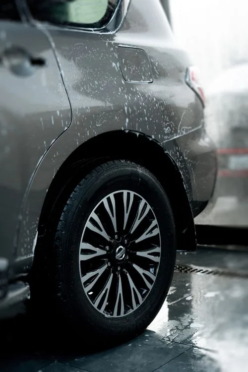 Clean alloy wheel and surrounding bodywork
